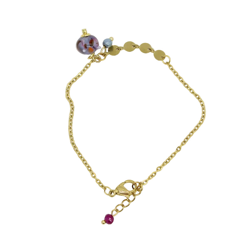 Bracelet en acier doré associant une chaîne classique et des pastilles plates, orné d'un charm avec perle en verre de Murano bleue