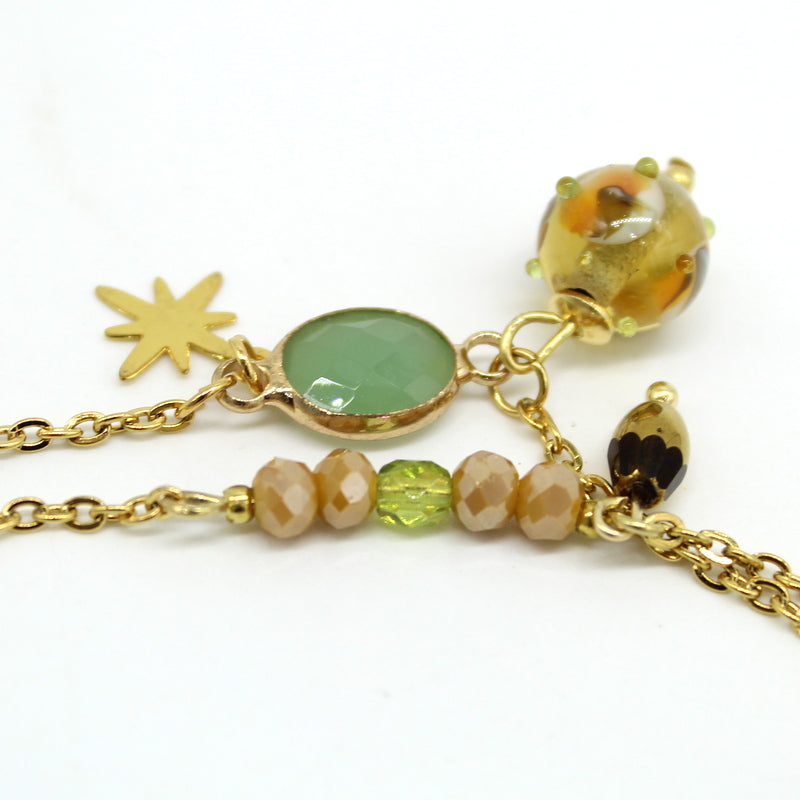 Zoom Bracelet double Salvia en acier doré avec perle en verre de Murano et breloques.