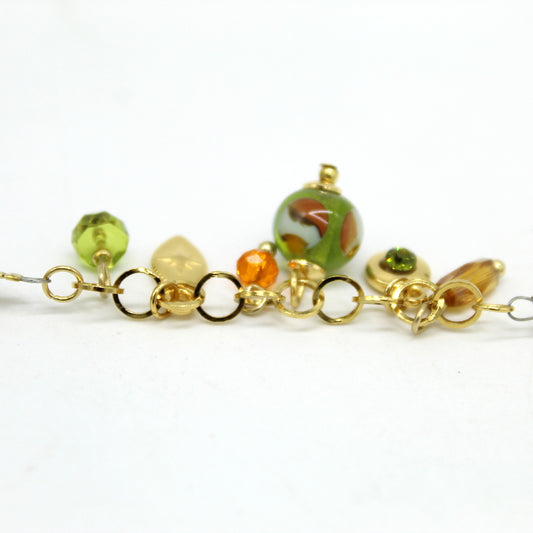 Bracelet Salvia avec perles boules, pampilles pendantes et perle centrale en verre de Murano.